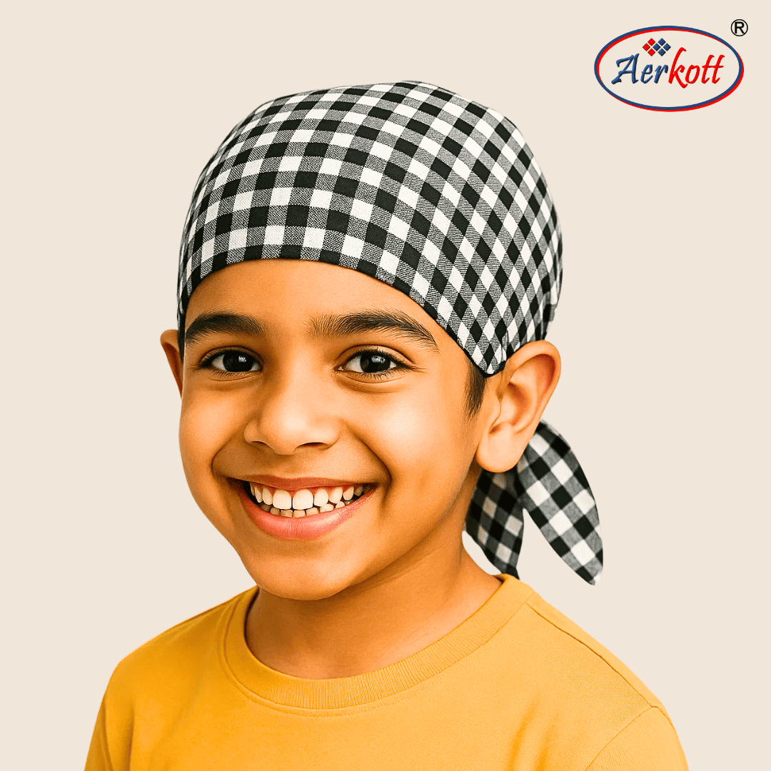 Child wearing a black and white checkered headscarf or 2 tani patka dastar bandwith Aerkott logo