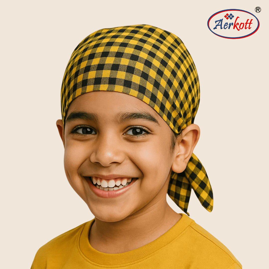 Child wearing a yellow and black checkered headscarf with Aerkott logo in the corner.