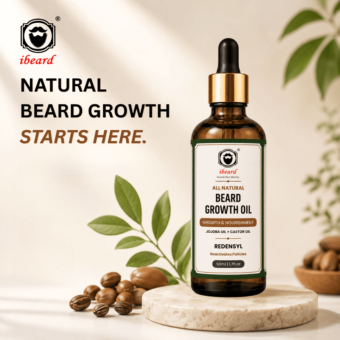 A bottle of iibeard beard growth oil stands on a round stone slab with natural props including castor beans and green leaves. The bottle is amber glass with a black dropper cap, gold collar, and a white label with green and brown accents.