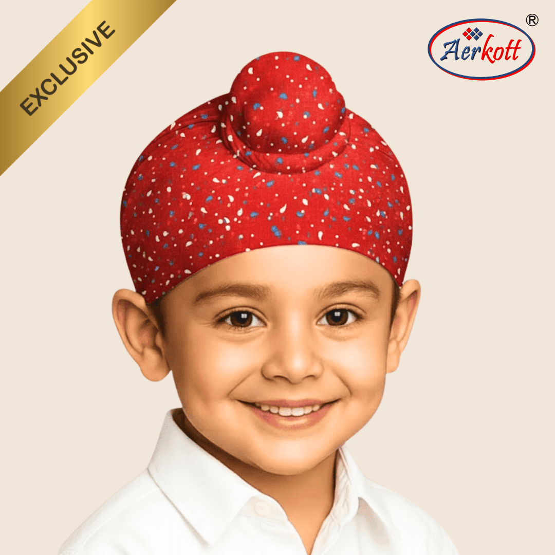 Child wearing a red patterned turban with Aerkott logo and 'Exclusive' text on beige background