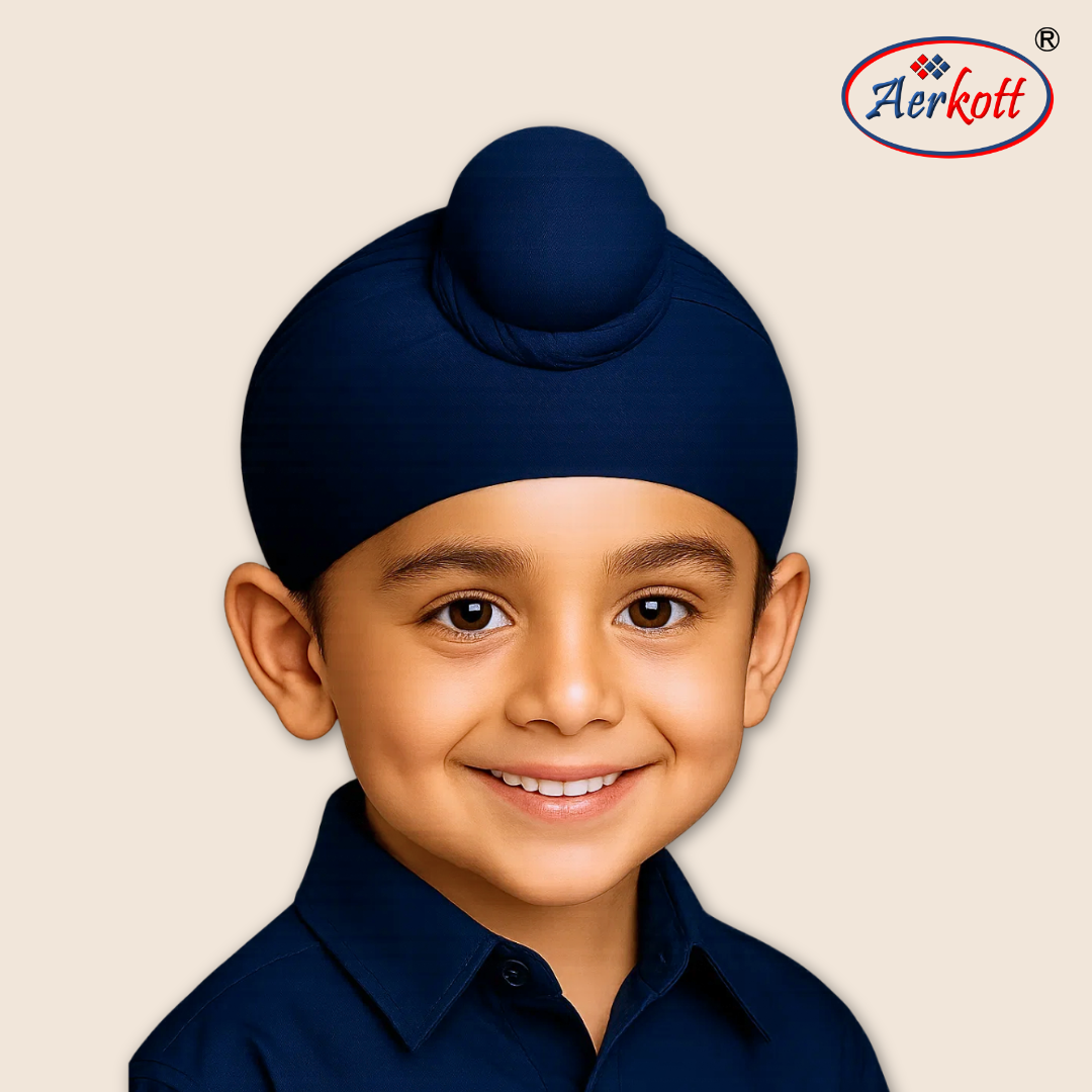 Child wearing a navy blue dastar with 4 strings with Aerkott logo in the corner