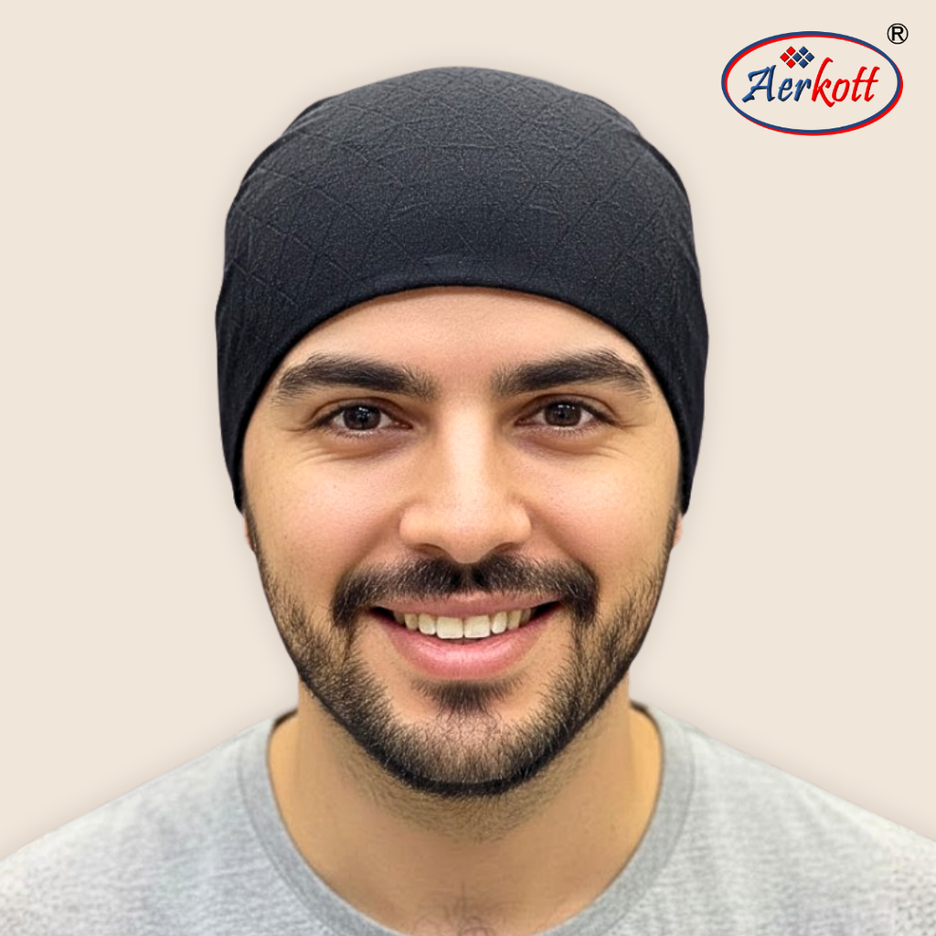 Man wearing a black headband with Aerkott logo in the corner