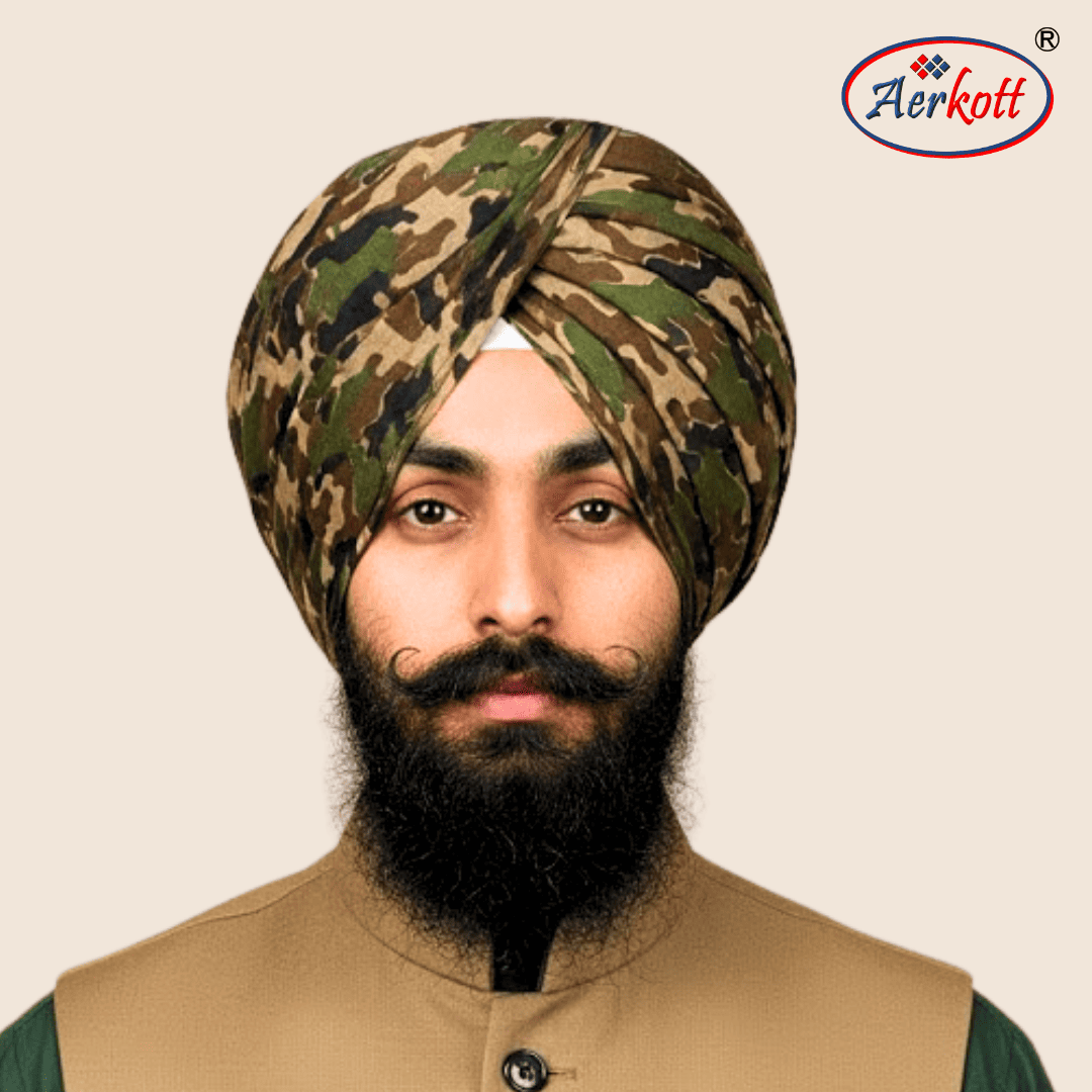 Man wearing a camouflage turban with Aerkott logo in the corner