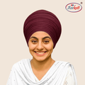 Woman wearing a maroon mulmul malmal turban with AERKOTT logo in the corner