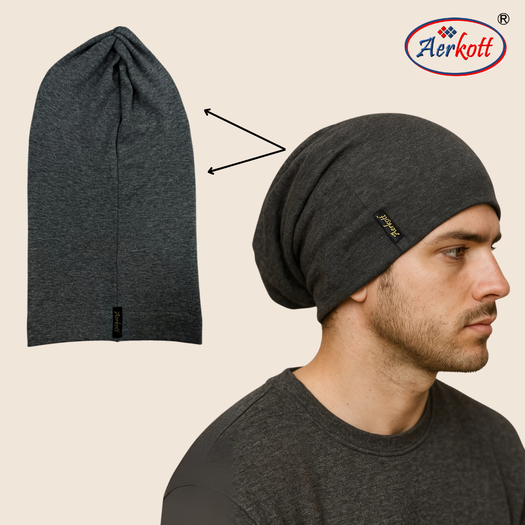 Dark gray beanie on a man's head with Aerkott logo, next to an unfolded beanie.