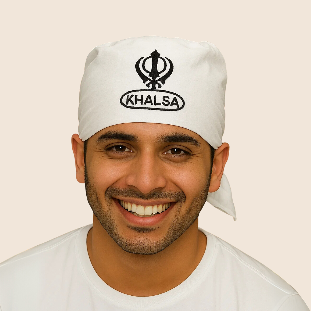 Man wearing a white headband with 'Khalsa' text and symbol on a beige background