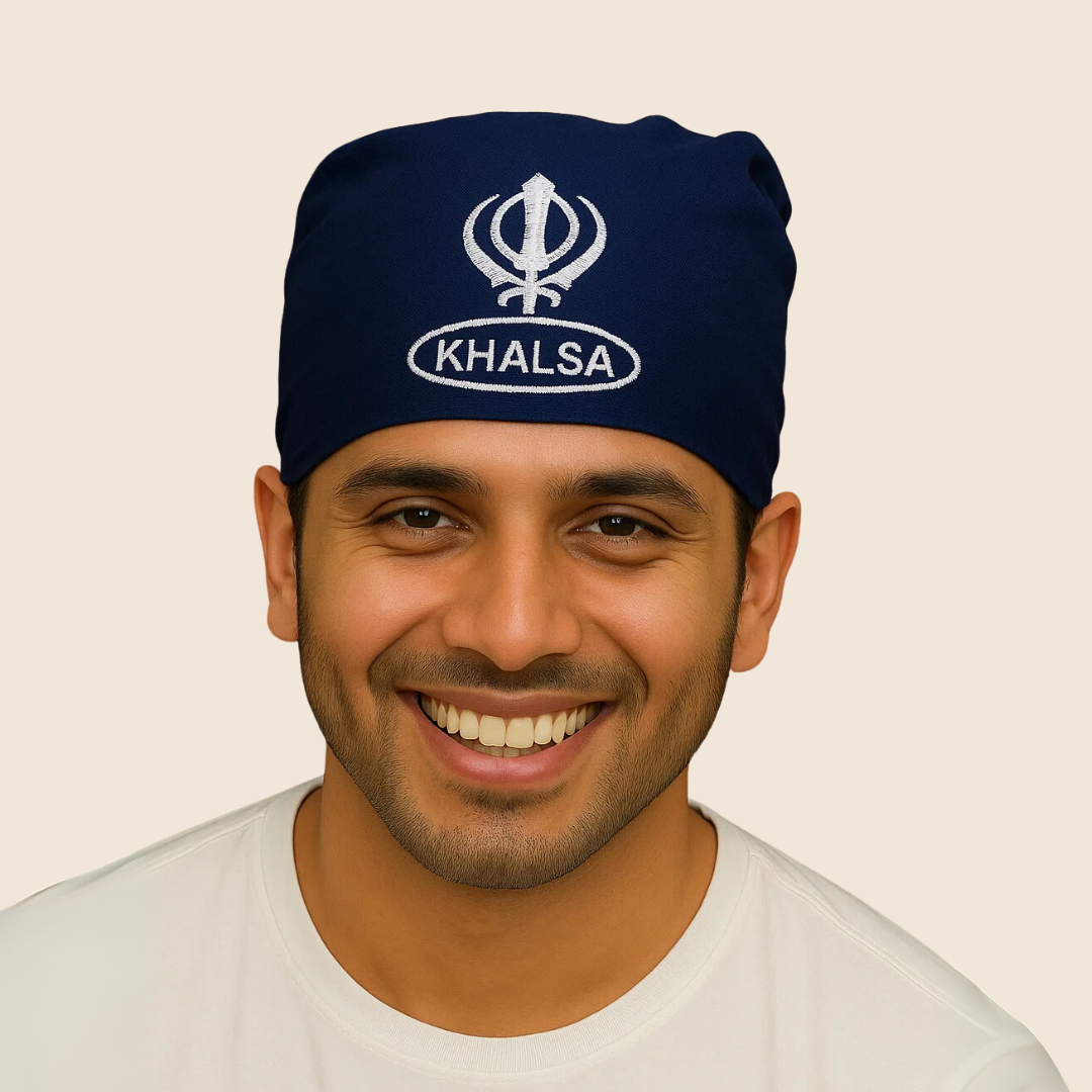 Man wearing a navy blue headband with 'Khalsa' logo on a beige background