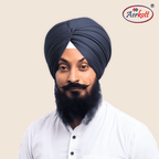 Man wearing a dark grey turban with AERKOTT logo in the corner