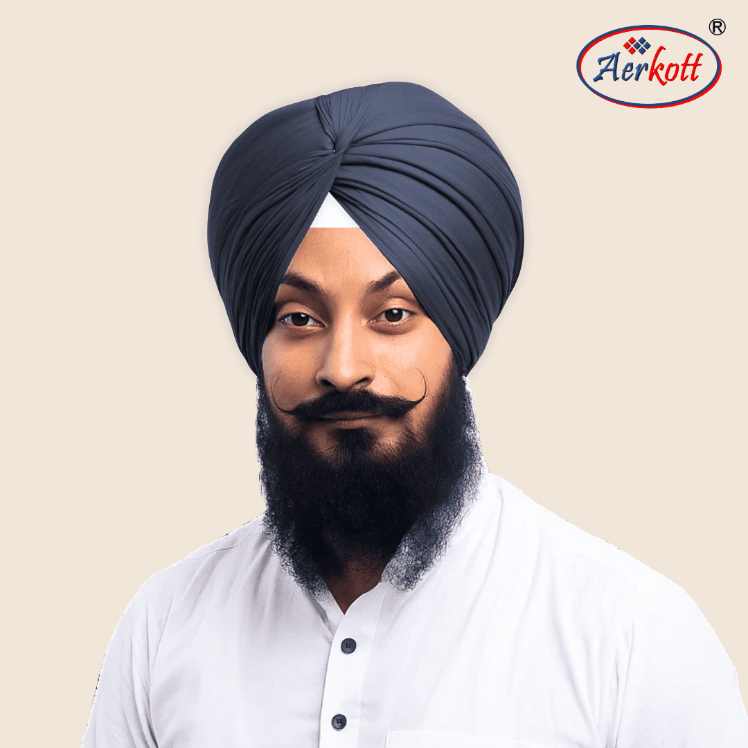 Man wearing a dark grey turban with AERKOTT logo in the corner