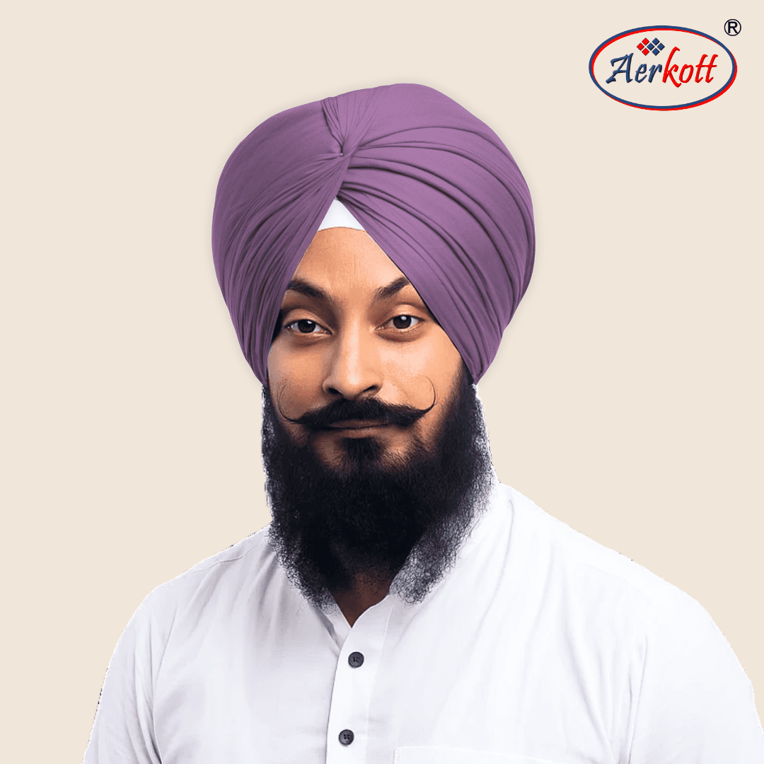 Man wearing a purple turban with Aerkott logo in the corner