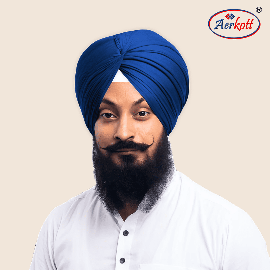 Man wearing a blue turban with AERKOTT logo in the corner
