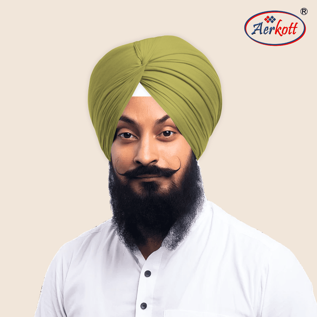 Man wearing a green turban with AERKOTT logo in the corner