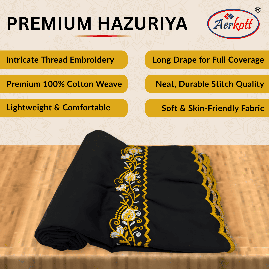 Black fabric with yellow embroidery on a wooden surface, featuring Aerkott brand.