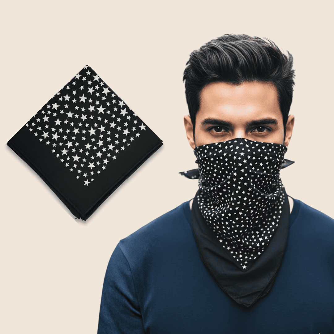 Man wearing a black and white patterned face mask with a matching bandana on a beige background