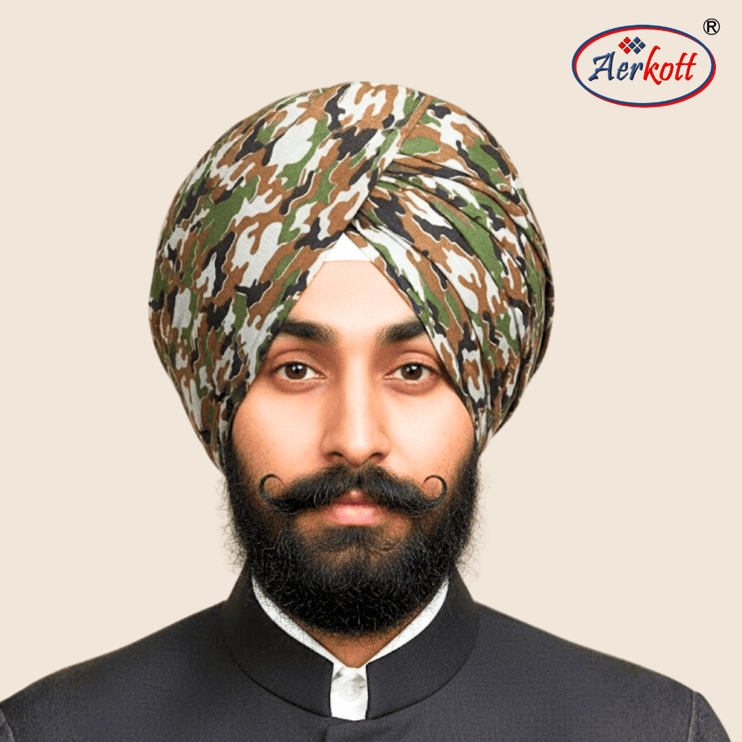 Man wearing a camouflage turban with Aerkott logo in the corner