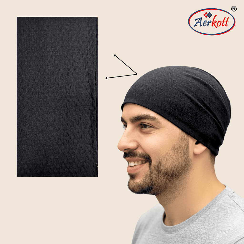 Man wearing a black headscarf with Aerkott logo on beige background