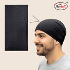 Man wearing a black headscarf with Aerkott logo on beige background