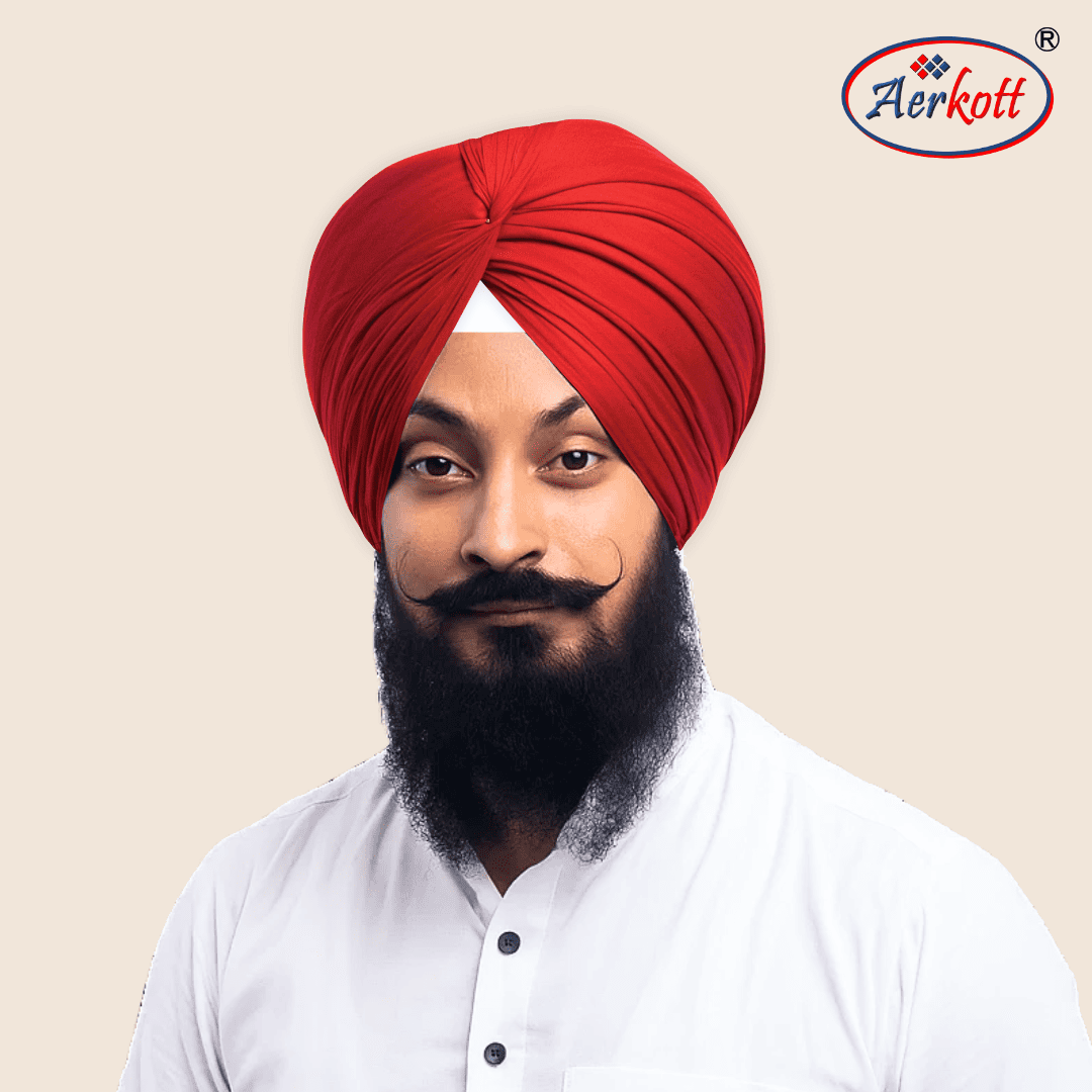Man wearing a red turban with Aerkott logo in the corner