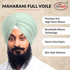 Person wearing a light green turban with Aerkott branding and product features listed.