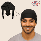 Man wearing a black head covering with Aerkott logo on beige background
