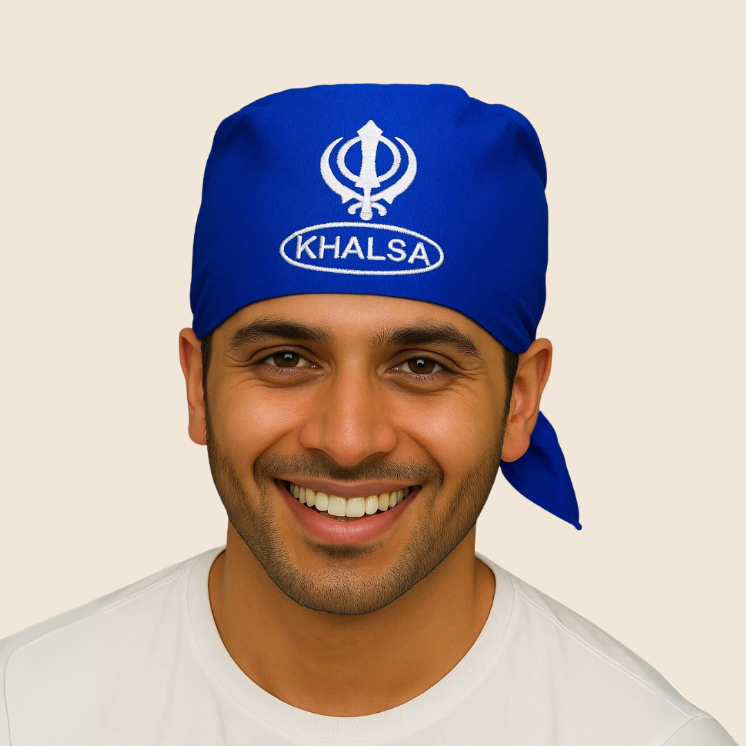 Man wearing a blue 'Khalsa' headscarf with a white emblem on a beige background