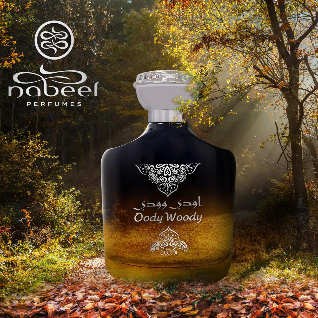 Perfume bottle labeled 'Ody Woody' by Nabeel Perfumes in a forest setting