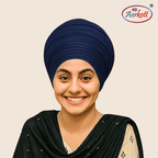 Woman wearing a navy blue mulmul malmal turban with Aerkott logo in the corner