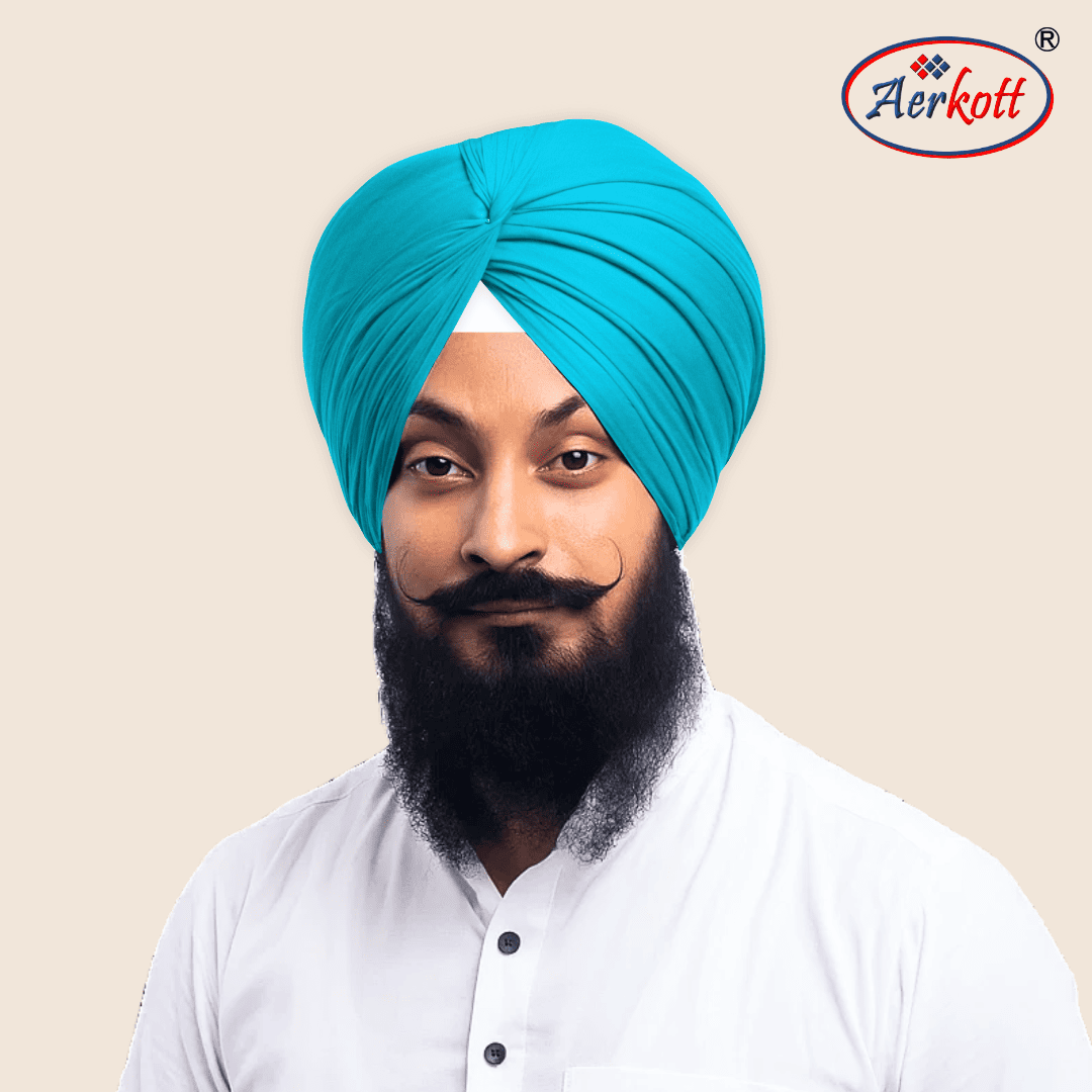 Man wearing a blue turban with AERKOTT logo in the corner