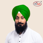 Man wearing a parrot green turban with AERKOTT logo in the corner