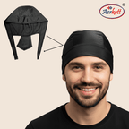 Man wearing a black head covering with Aerkott logo on beige background