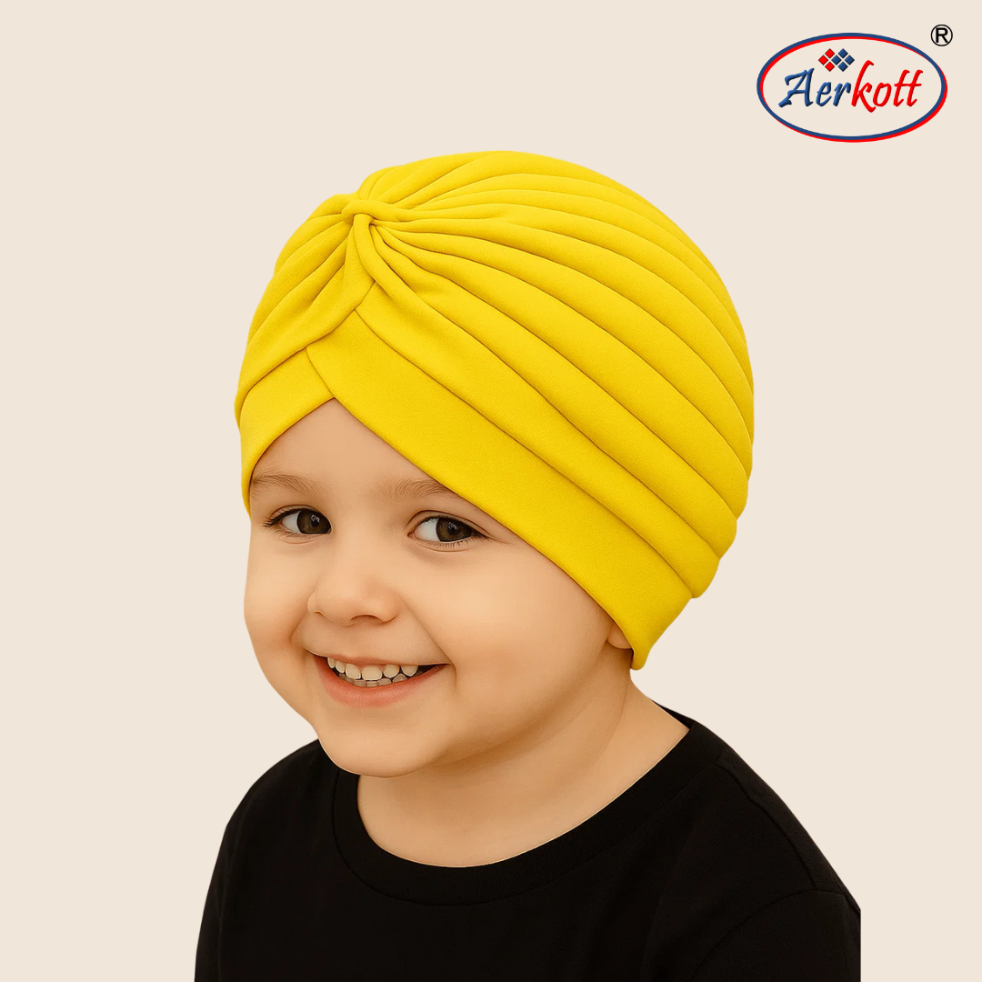 Child wearing a yellow turban with Aerkott logo in the corner