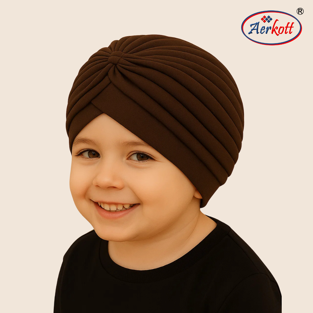 Child wearing a brown turban with Aerkott logo in the corner