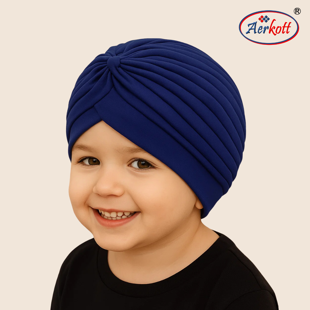 Child wearing a blue turban with Aerkott logo