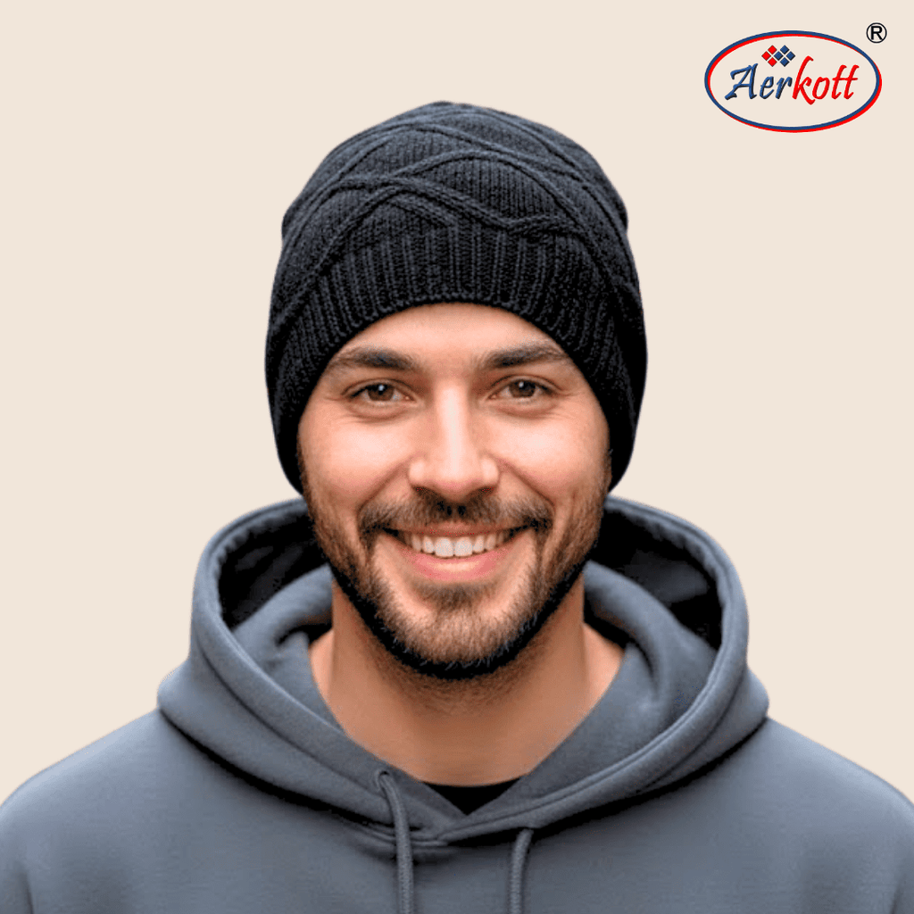 Man wearing a black knit beanie and gray hoodie with AERKOTT logo in the corner.