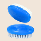 Two blue pet brushes with white bristles on a beige background